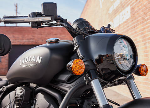 Closeup of the tank, headlight, and handlebars on a 2026 Indian Scout Bobber cruiser motorcycle.