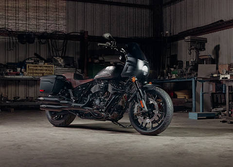 Side profile of a parked 2026 Indian Sport Chief motorcycle in a garage.