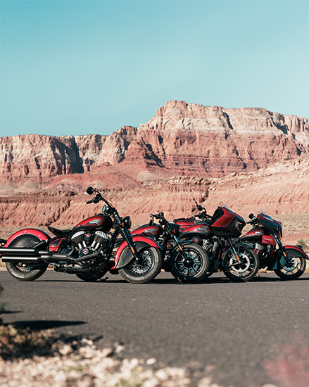 4 2026 Indian 125th Anniversary Edition motorcycles in a lineup.