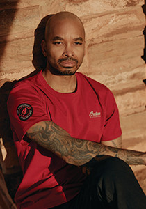 Explore the 125th Crew Tee.