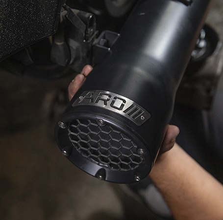 Rider takes sharp bend on an Indian Motorcycle with upgraded performance accessories. 