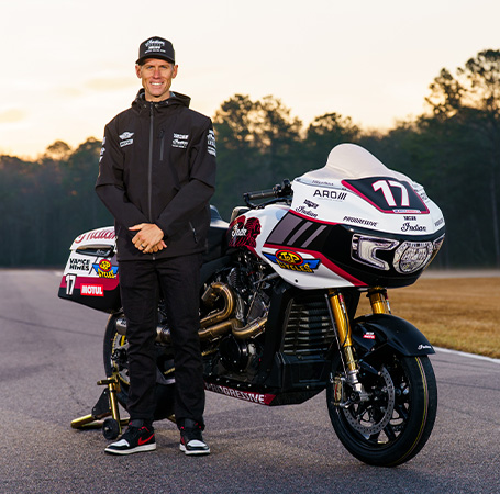 Indian Motorcycle's Wrecking Crew member Troy Herfoss #1 stands in front of Indian Challenger racing motorcycle. 