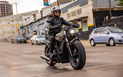 Woman riding an Indian Motorcycle in the city