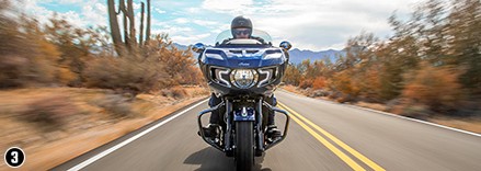 man riding an indian motorcycle in zion national park, utah