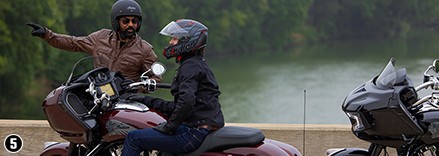 2 indian Motorcycle riders stopped on the road discussing directions