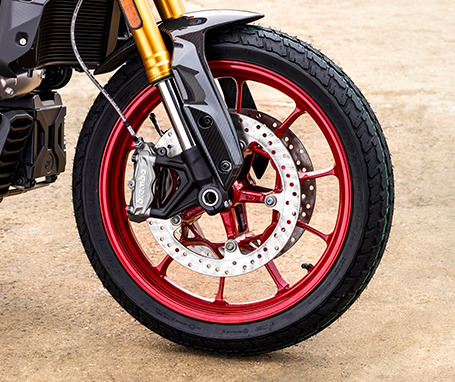 The wheel of an Indian motorcycle.