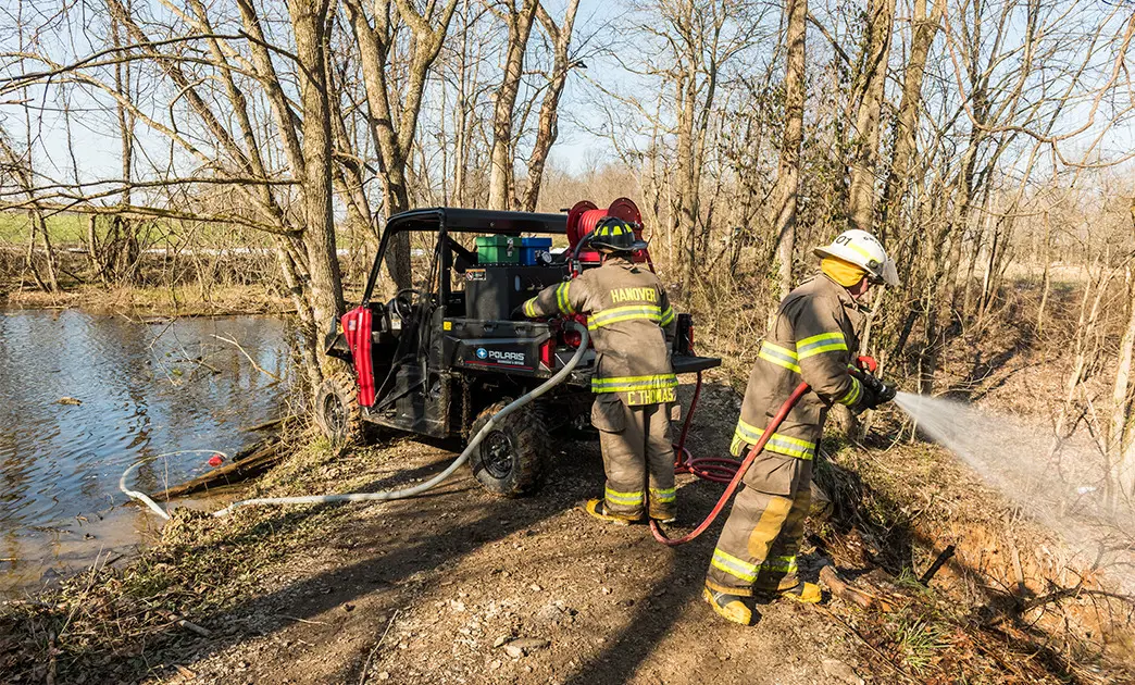 fire crew putting out flames with a polaris ranger utv