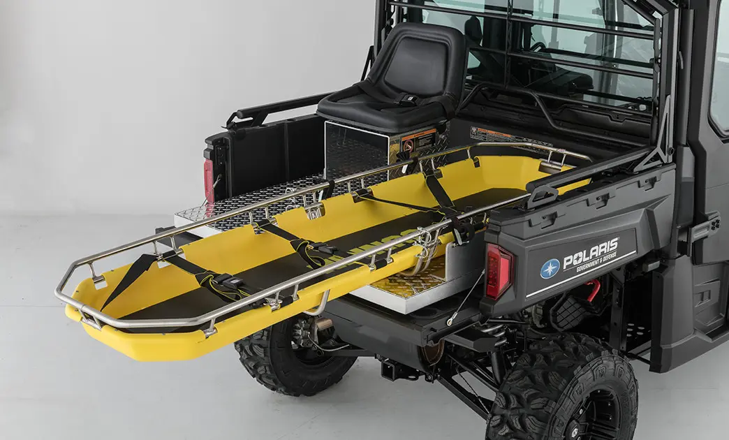 rescue skid and seat in the cargo box of a polaris ranger