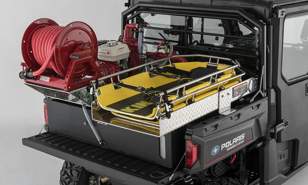 rescue skid and water pump in the cargo box of a polaris ranger