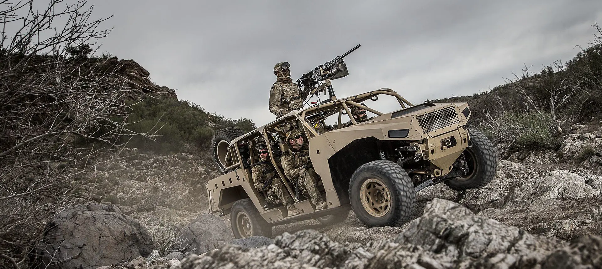 soldiers crusing in the dagor a1 tactical vehicle on rocky terrain