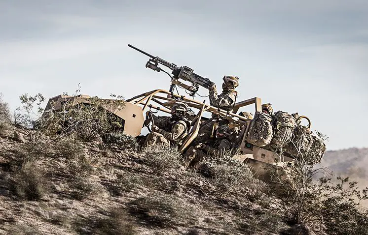 soldiers driving up a rocky trail in a fully loaded dagor a1 tactical vehicle