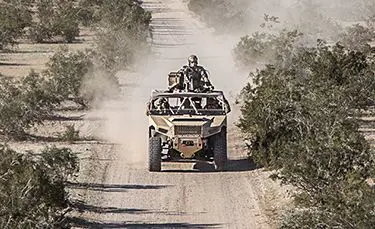 fully loaded dagor a1 tactical vehicle on a dusty trail