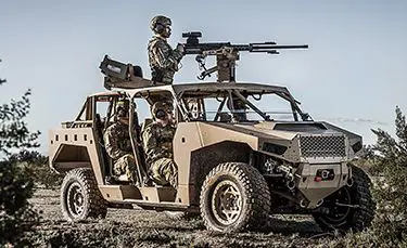 soldiers scoping out the environment in their dagor a1 tactical vehicle