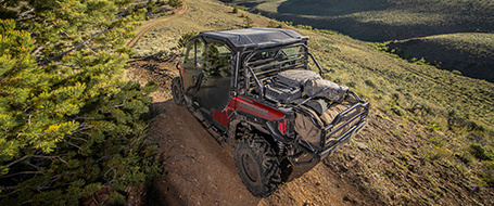 General 1000 riding on a trail in a mountain