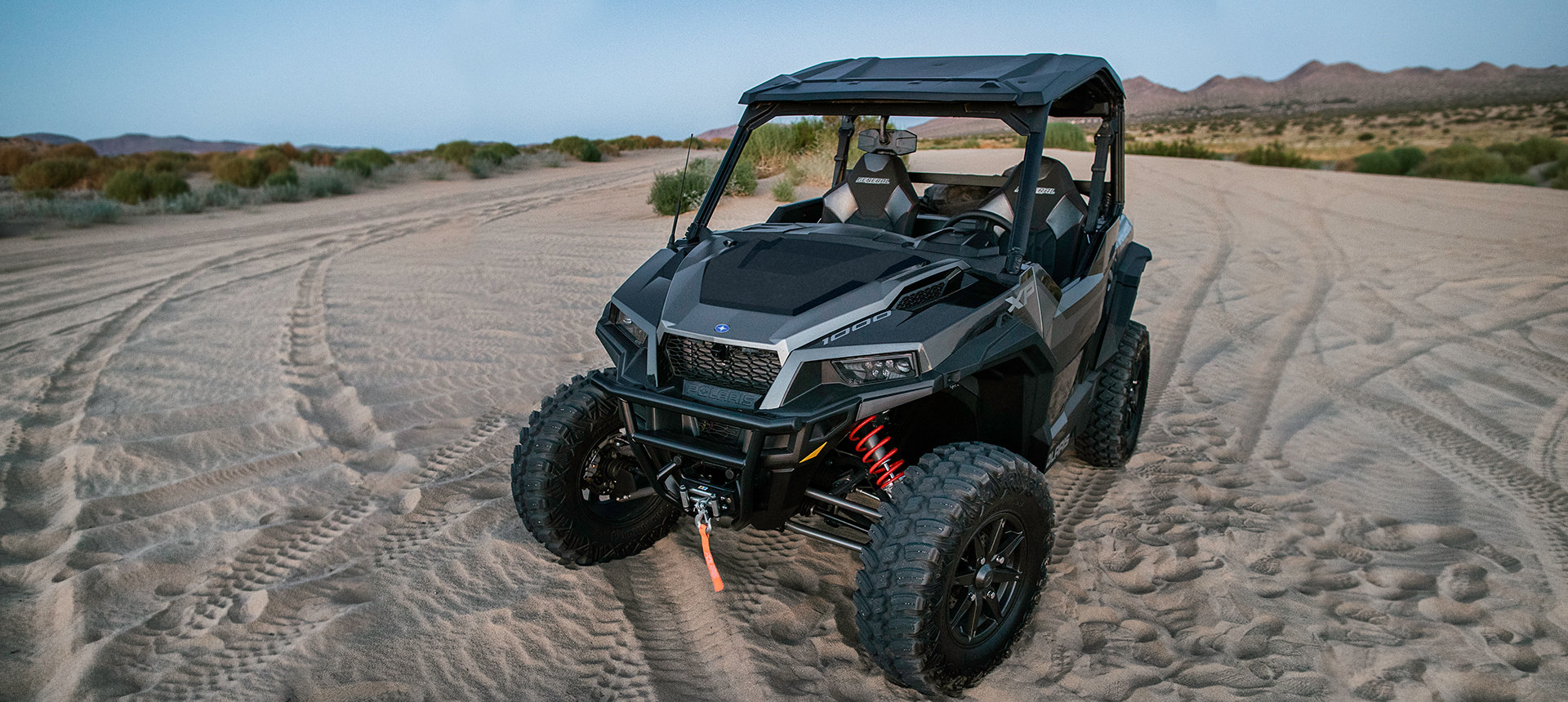 General XP 1000 parked on a road in the sand