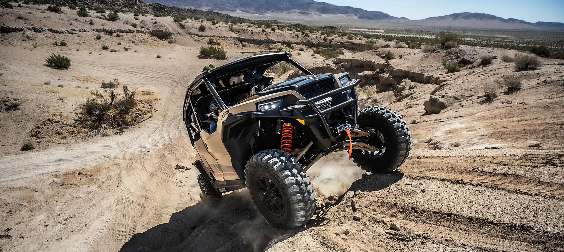 General XP 1000 riding uphill a desert trail