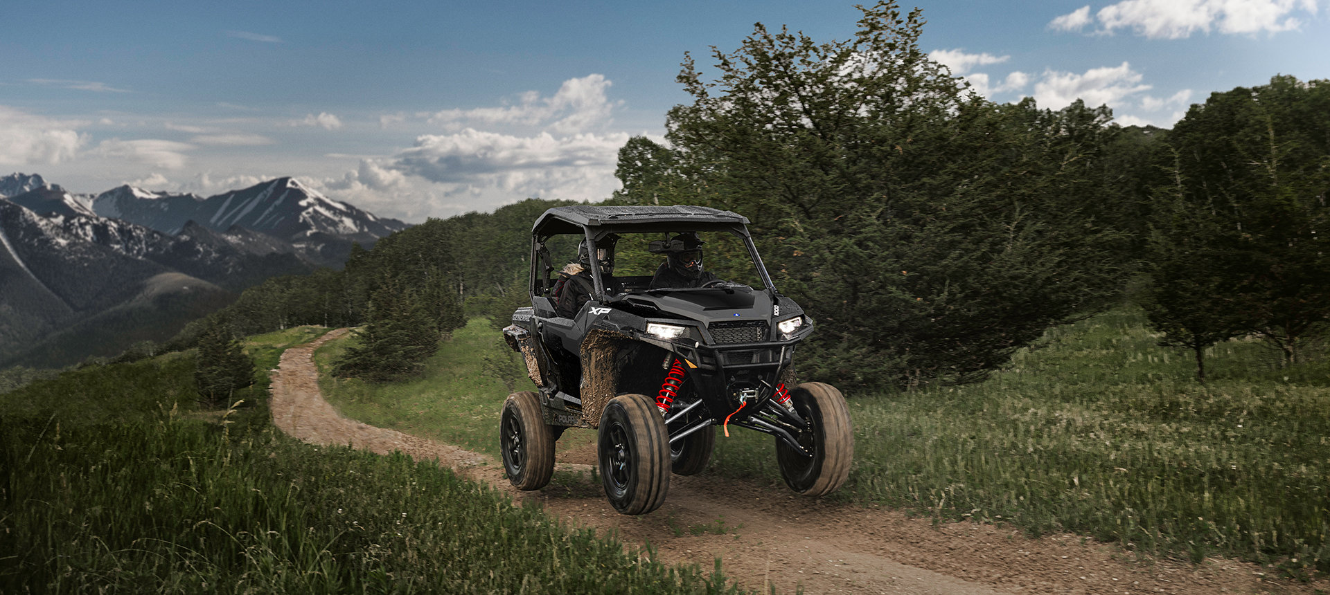 General XP 1000 vehicle on a trail in the mountains
