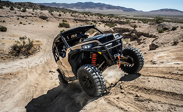 General XP 1000 riding uphill a desert trail