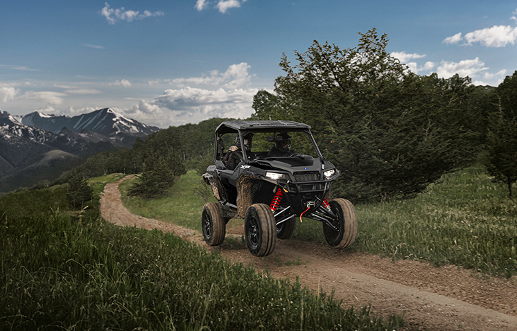 General XP 1000 vehicle on a trail in the mountains