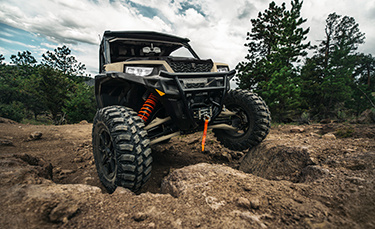 General XP 1000 vehicle riding over dirt rocks