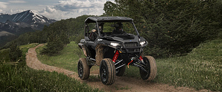 General XP 1000 vehicle riding on a trail in the mountains