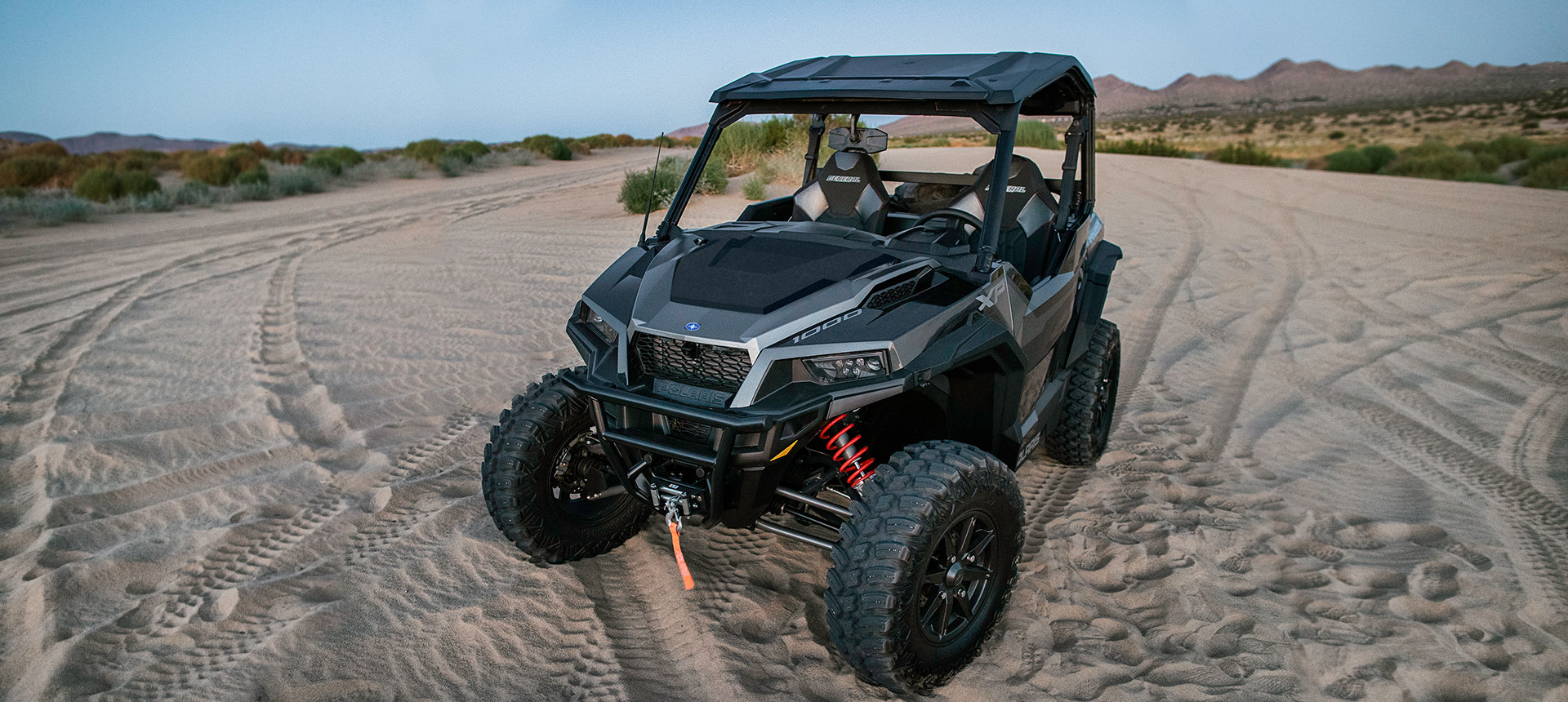 General XP 1000 parked on a road in the sand