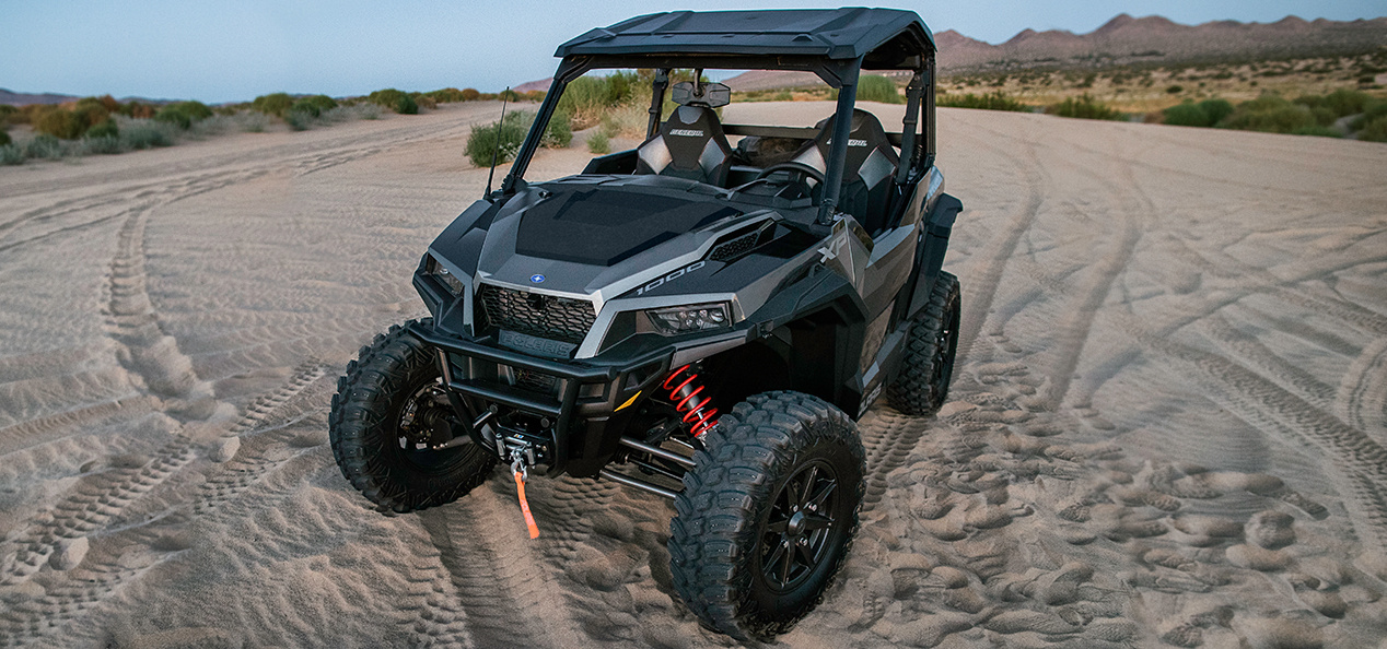 General XP 1000 parked on a road in the sand