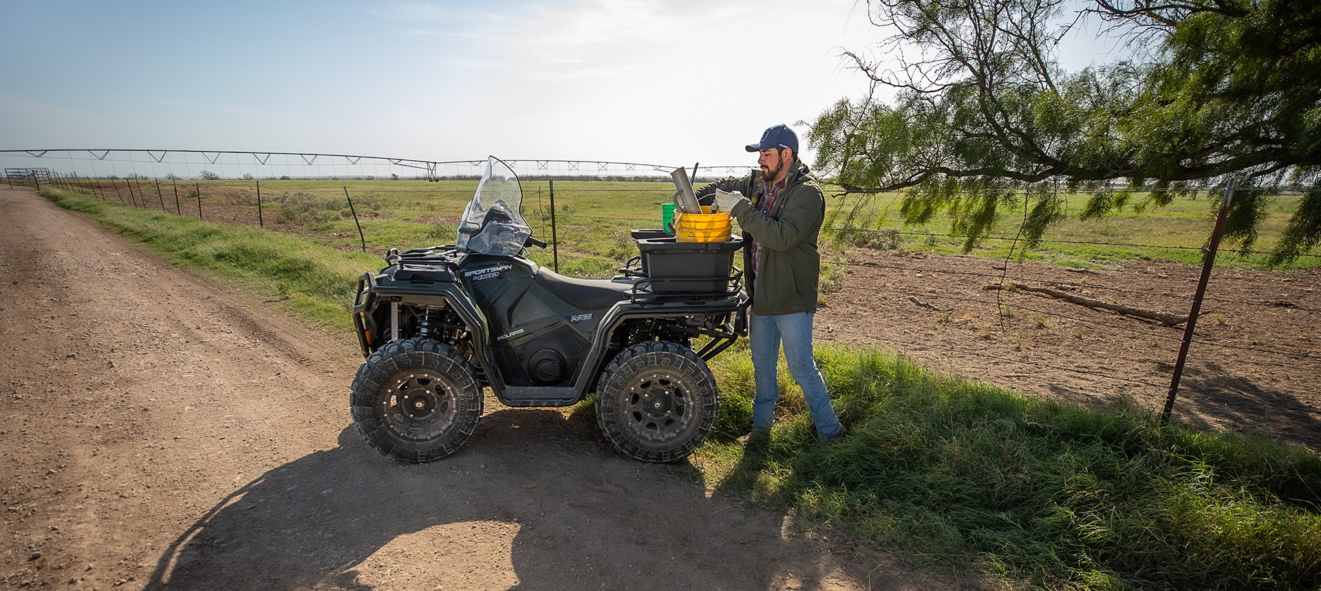 Sportsman 450 and its owner loading the storage box