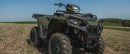 Sportsman 570 on a trail field