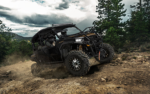 polaris general xp 4 1000 powering through a rocky landscape