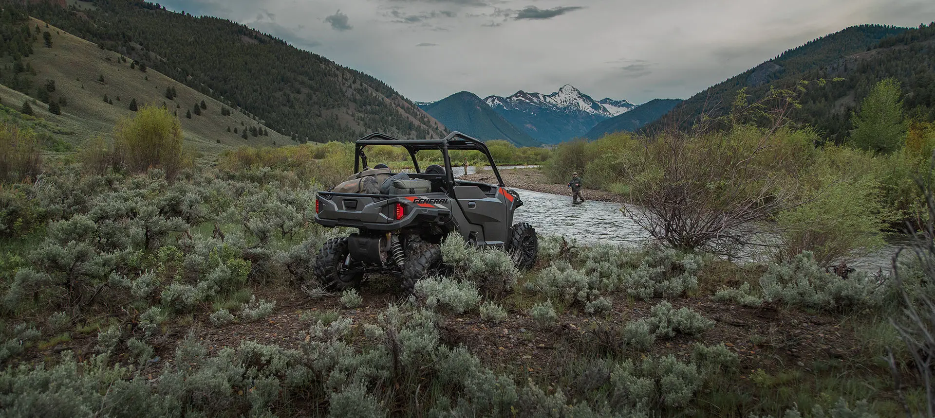Polaris General 1000 side by side parked by a river