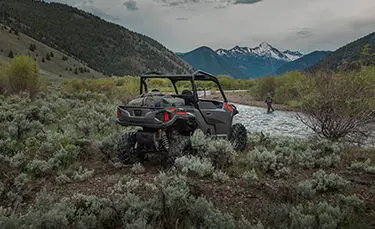 Polaris General 1000 side by side parked by a river