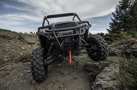 Polaris General 1000 side by side crawling over rocks with unmatched performance