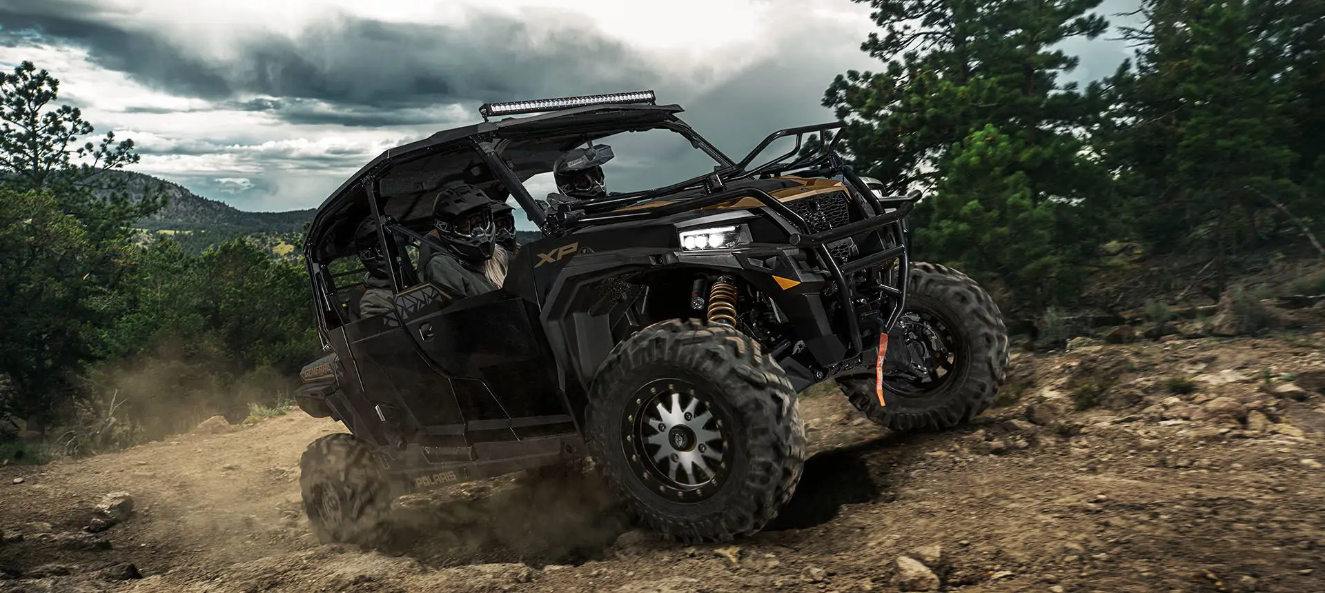 Polaris General XP 4 1000 side by side driving down a rocky trail with unmatched precision