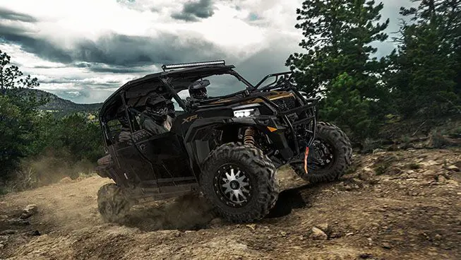 Polaris General XP 4 1000 side by side driving down a rocky trail with unmatched precision