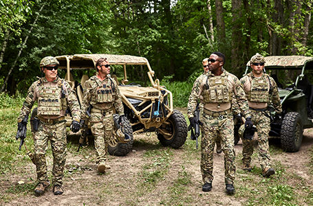 soldiers gathered near versatile mrzr alpha tactical vehicles