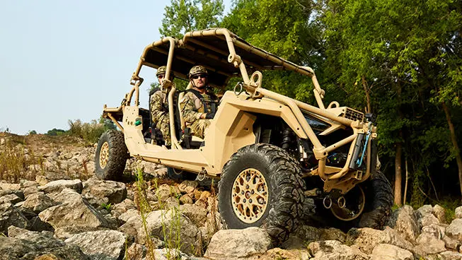 fully loaded mrzr alpha 4 climbing over rocky terrain
