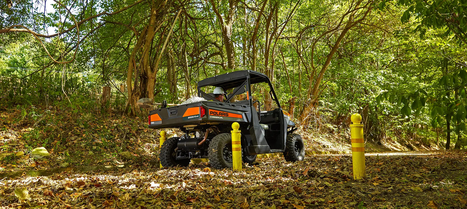 pro xd full-size diesel work UTV driving through a park