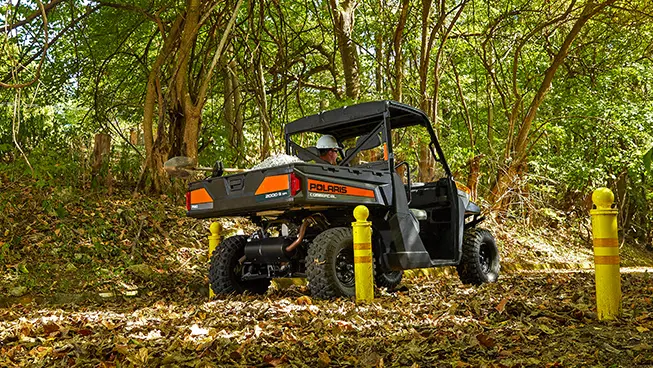 pro xd full-size diesel work UTV driving through a park