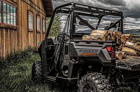 a ranger 1000 loaded with wood into its cargo box