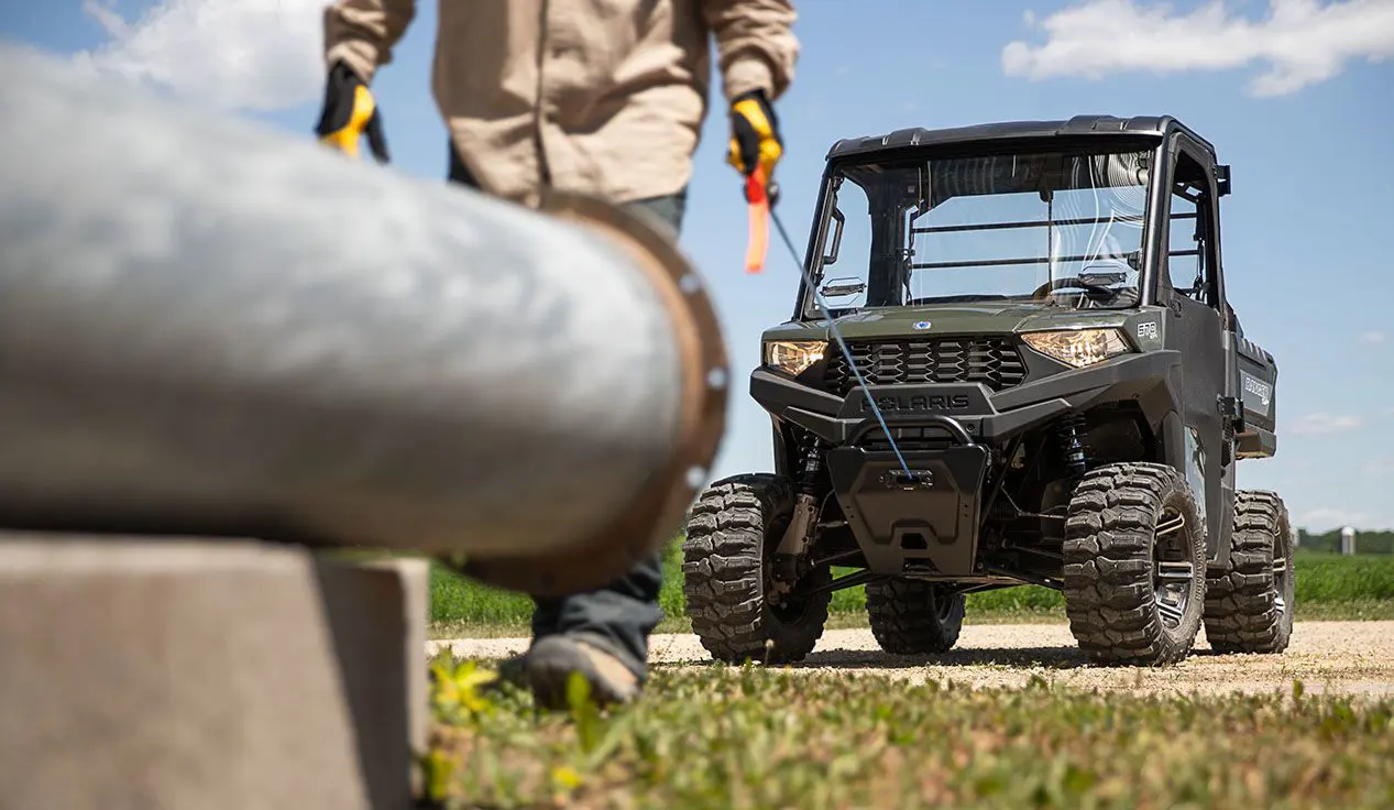 Man pulling out the winch installed on his RANGER SP 570