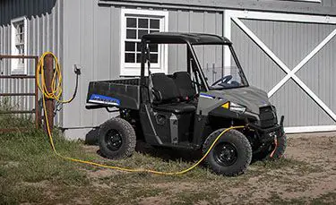 ranger ev electric utv charging on a farm