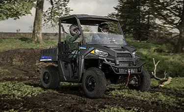 2 riders quietly trail riding in their polaris ranger ev