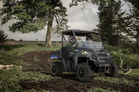 2 riders quietly trail riding in their polaris ranger ev
