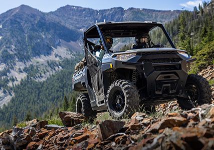 ranger xp 1000 riding on a rocky trail with ease thanks to its 13" of ground clearance