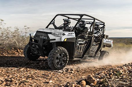 Ranger Crew XP 1000 racing in a rocky trail