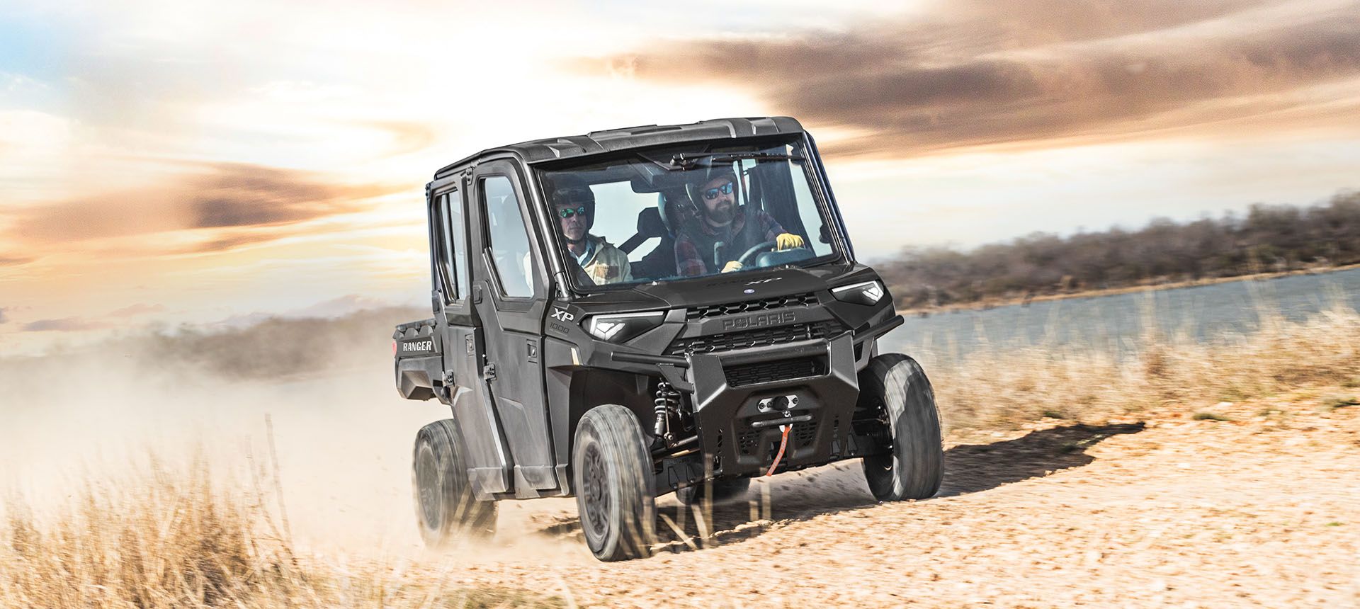 Ranger Crew XP 1000 racing on a trail