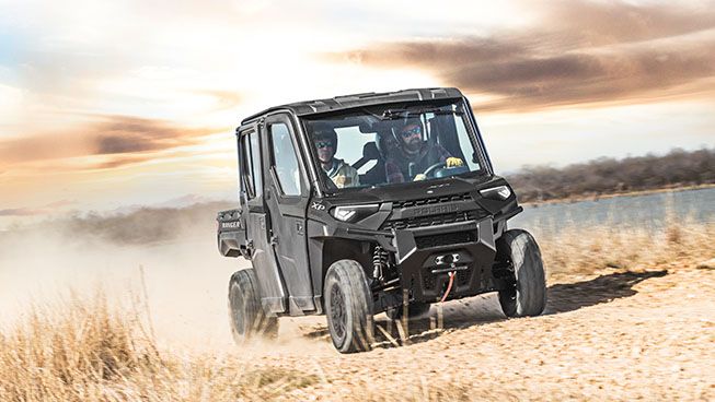 Ranger Crew XP 1000 racing on a trail