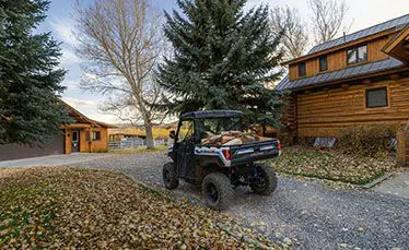 ranger xp kinetic side by side with wood loaded in the cargo bed