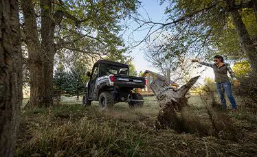 ranger xp kinetic side by side pulling out a stump